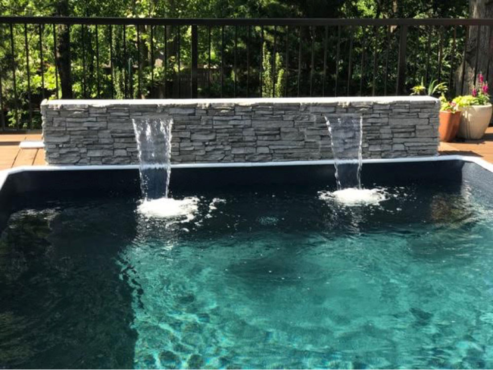 Rectangular-Pool-Custom-Water-Features-by-Aqua-Star-On-Ground-Pools How much value does a pool add to a home?